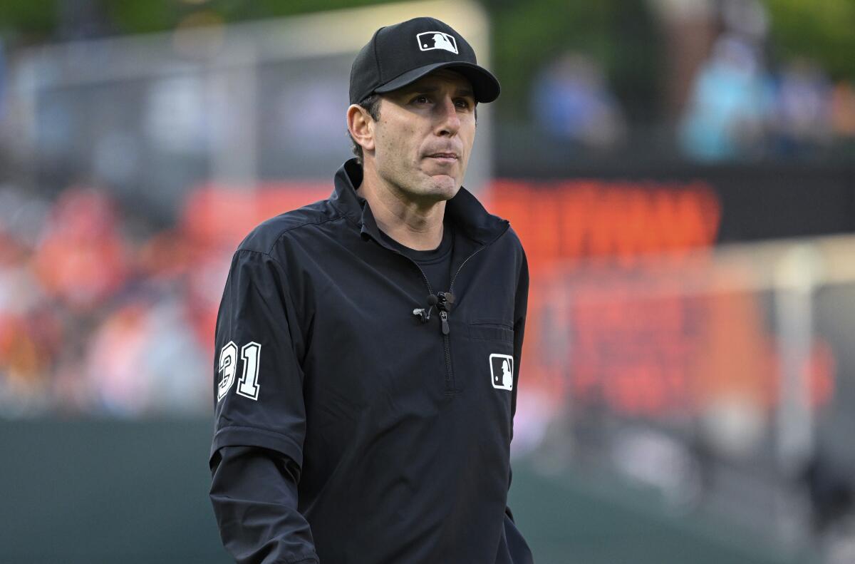 Major League Baseball umpire Pat Hoberg walks on the field during a game between the Baltimore Orioles and Angels.