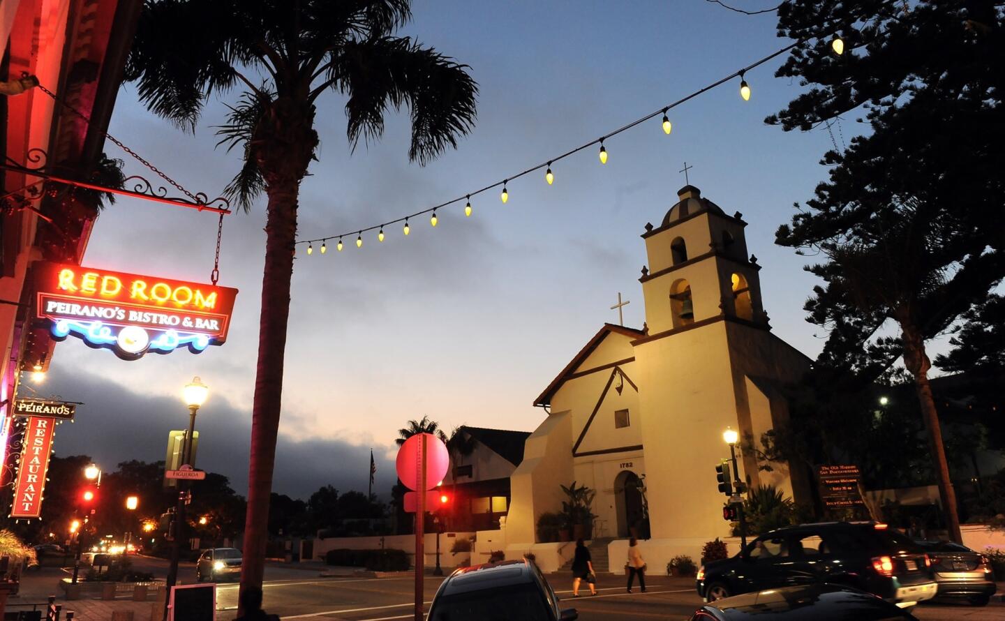 At night, downtown Ventura lights up the mission.