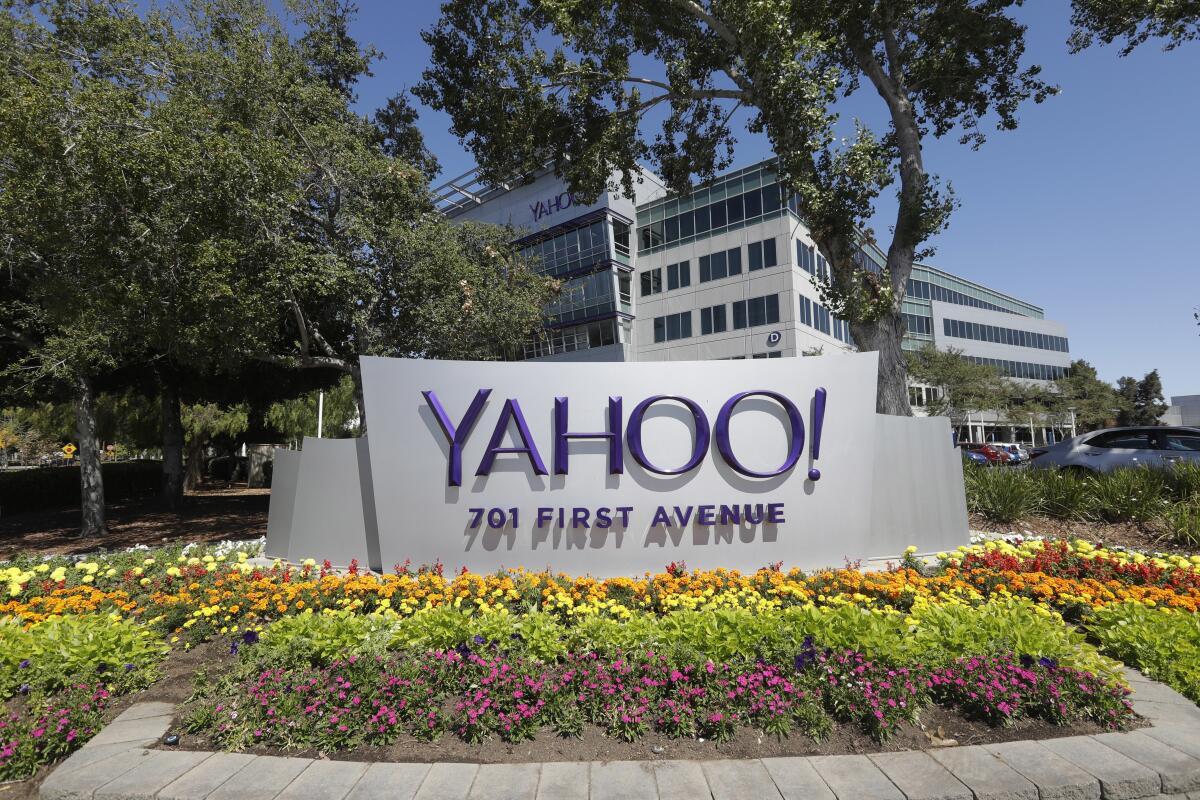 Flowers bloom in front of a Yahoo sign at the company's headquarters in Sunnyvale, Calif.