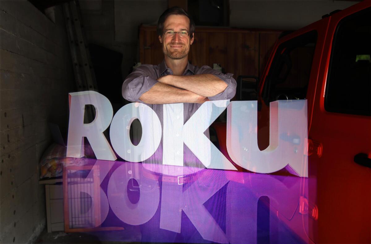 The Roku logo seems to hover in front of the company's vice president of programming and engagement. 