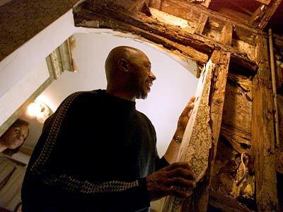 Donna and Russell Merriweather, who waived a home inspection, discovered rotting wood in the walls after moving into their Leimert Park home.