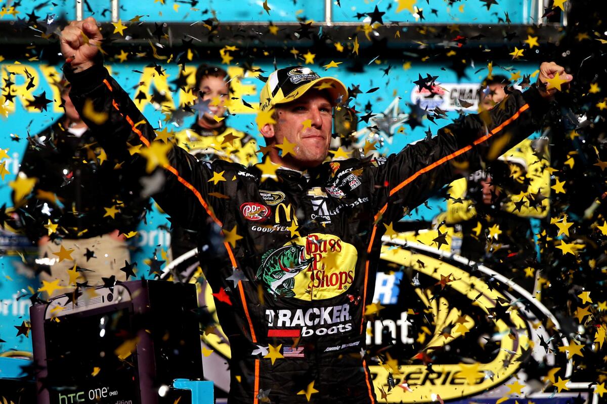 Jamie McMurray celebrates in victory lane after winning the NASCAR Sprint All-Star Race at Charlotte Motor Speedway on Saturday.