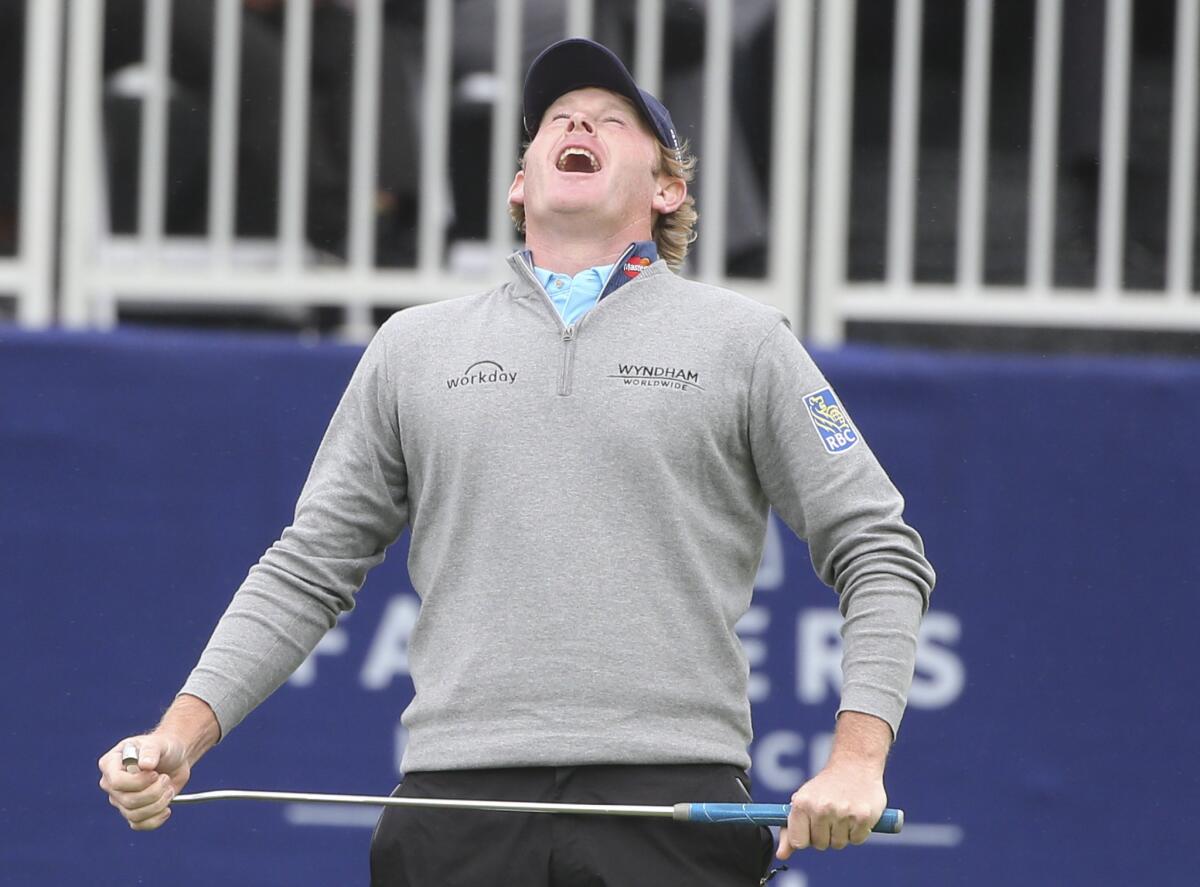 Brandt Snedeker reacts to missing his birdie putt on the 18th green at Torrey Pines during the final round of the Farmers Insurance Open.