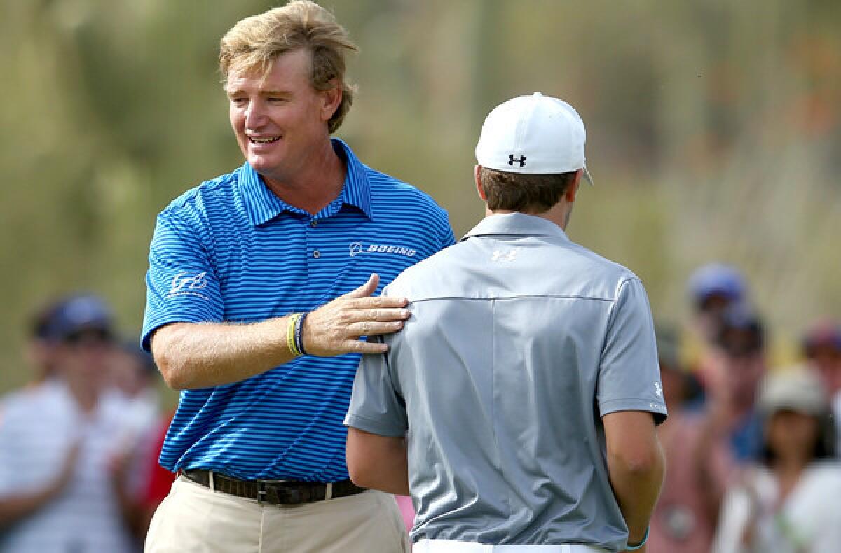 Ernie Els, left, is congratulated by Jordan Spieth after clinching their Match Play Championship quarterfinal, 4 and 2, on Saturday.