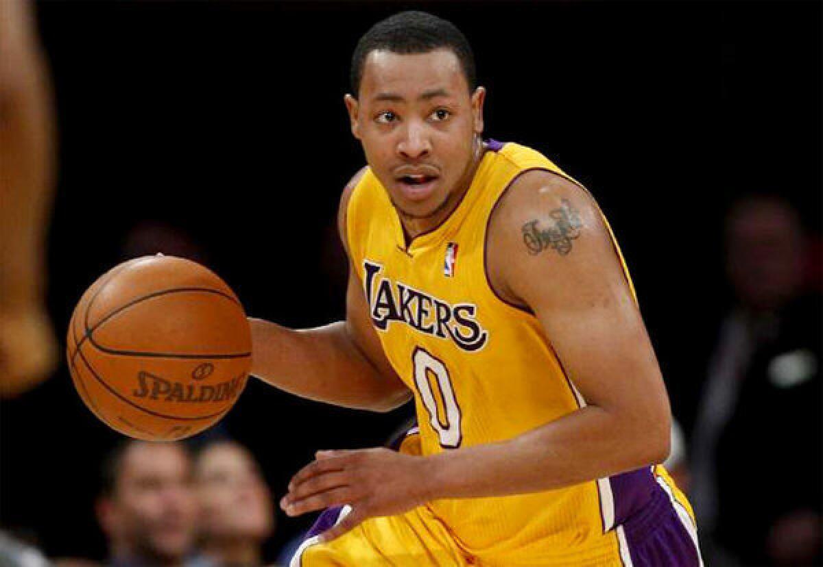 Lakers guard Andrew Goudelock brings the ball up the court during a game against the Charlotte Bobcats last season.