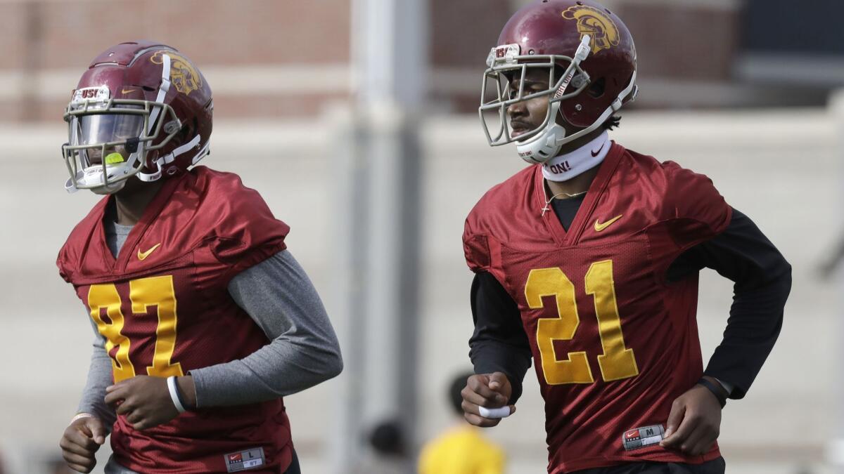 USC wide receivers John Jackson III, left, and Tyler Vaughns during the team's spring football practice on Tuesday.