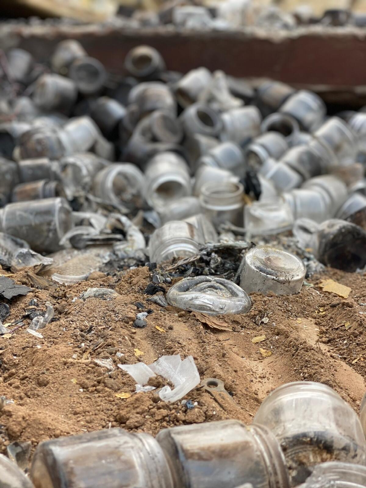 Broken glass bottles from a hemp fire.