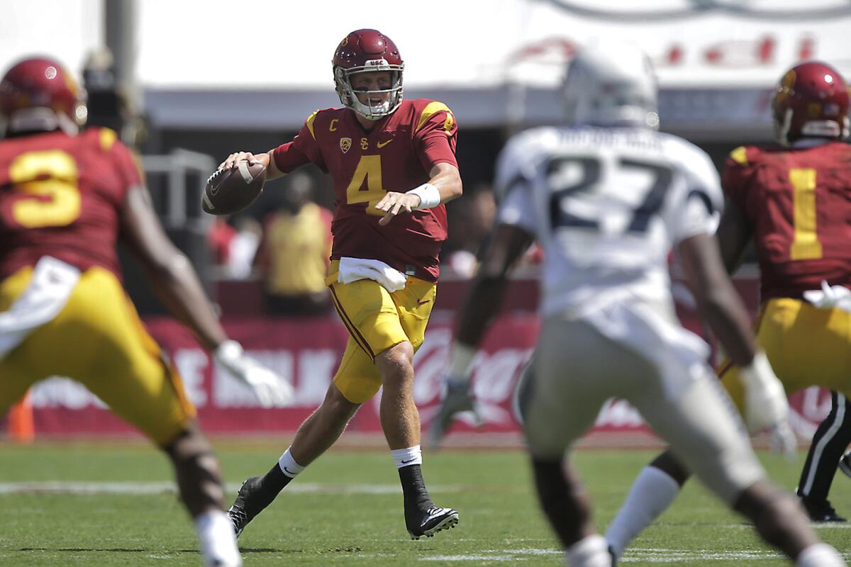 Max Browne, who completed 23 of 30 passes for 182 yards and two touchdowns in USC's 45-7 victory over Utah State, looks for a receiver.