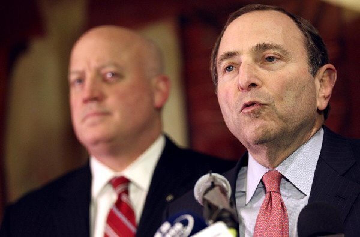 NHL Commissioner Gary Bettman, with Deputy Commissioner Bill Daly in the background, gives a grim report of the labor negotiating session Thursday.