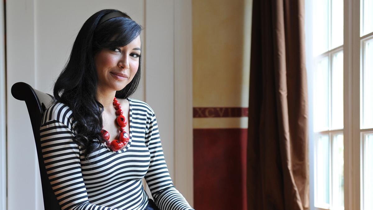 Former "Glee" star Naya Rivera is pictured sitting at a window