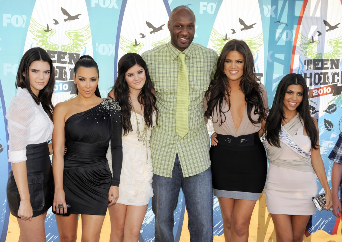 From left, Kendall Jenner, Kim Kardashian, Kylie Jenner, Lamar Odom, Khloe Kardashian and Kourtney Kardashian attend the Teen Choice Awards in 2010.