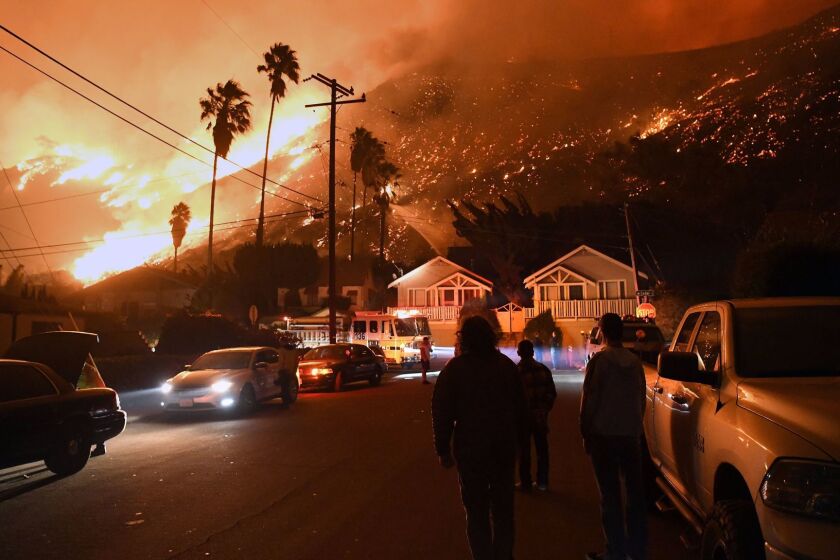 VENTURA, CA - DECEMBER 5, 2017: Residents watch the Thomas Fire on Prospect Street in Ventura. (Michael Owen Baker / For The Times)