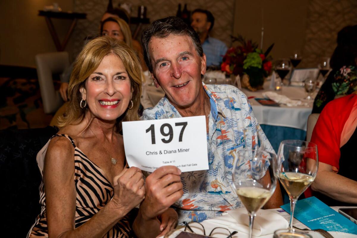Diana and Chris Miner bid on auction items at Beach Ball Gala held at the Pasea Resort, to raise funds for Childhelp.