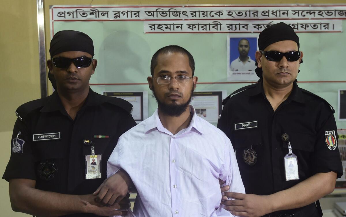 Farabi Shafiur Rahman, center, was arrested Monday in the slaying in Bangladesh of secular American blogger Avijit Roy.