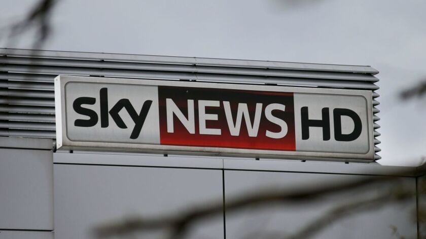 A sign reading "Sky News HD" stands outside pay-TV giant Sky Plc's headquarters in London.