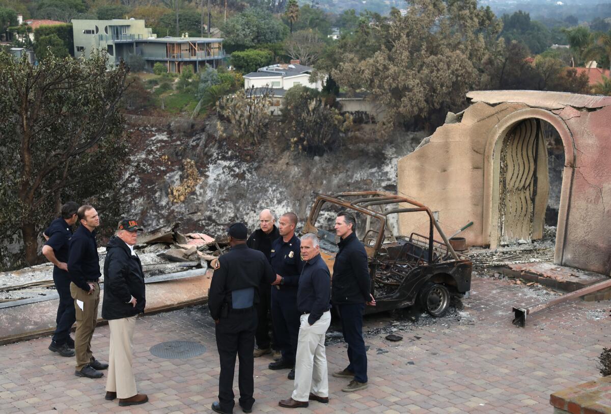 President Trump surveys the damage from the Woolsey fire in Malibu on Saturday.