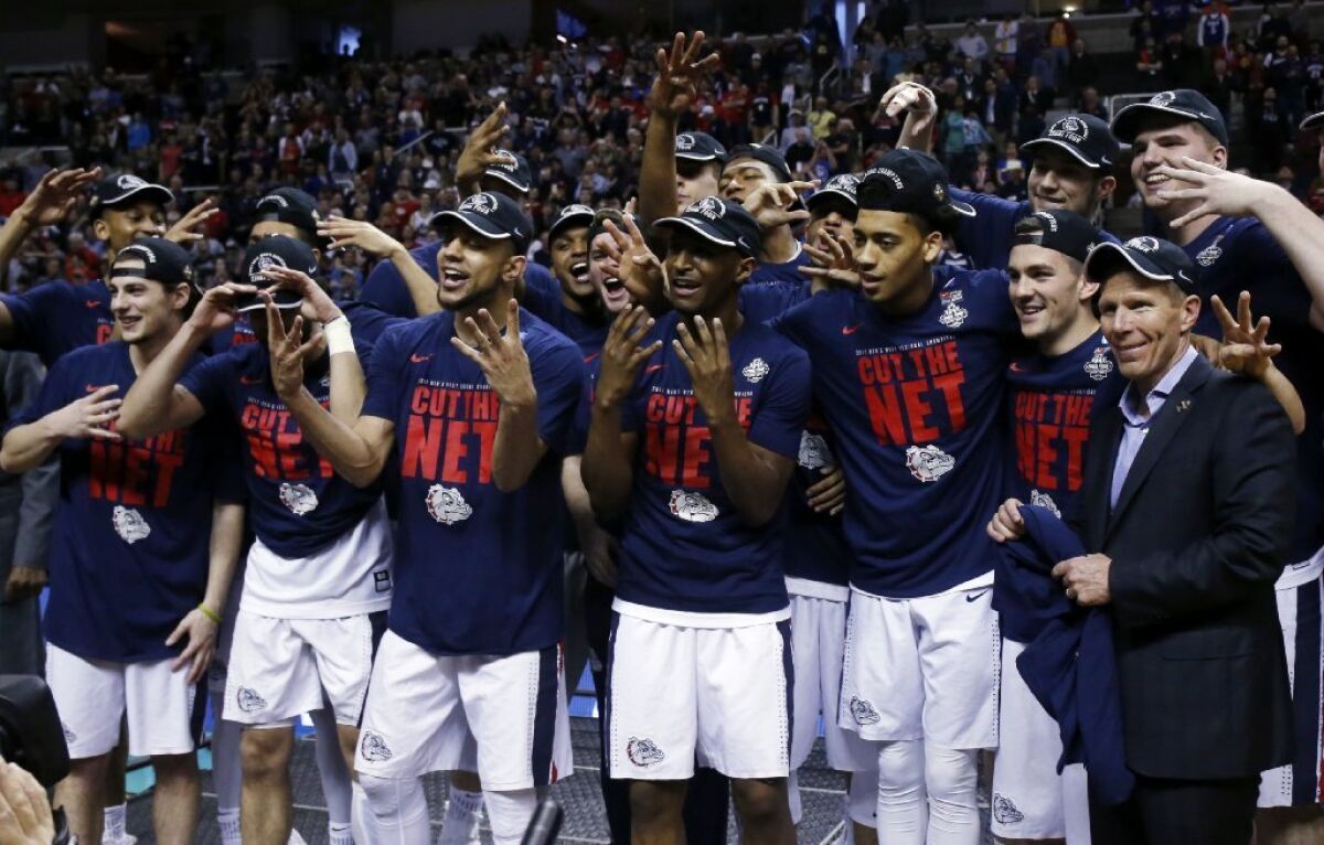 Gonzaga players celebrate after beating Xavier, 83-59, to advance to the Final Four of the NCAA tournament on March 25.