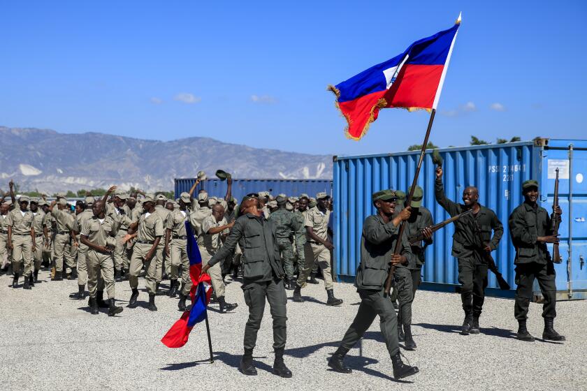 FILE - New members of the Armed Forces of Haiti celebrate after their graduation ceremony in Port-au-Prince, Haiti, Thursday, Dec. 22, 2022. (AP Photo/Odelyn Joseph, File)