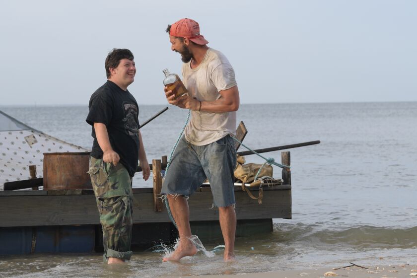 (L-R)- Zack Gottsagen and Shia LaBeouf The Peanut Butter Falcon in a scene from ÒThe Peanut Butter Falcon.Ó Credit: Seth Johnson/Road Side Attractions/ Armory Films