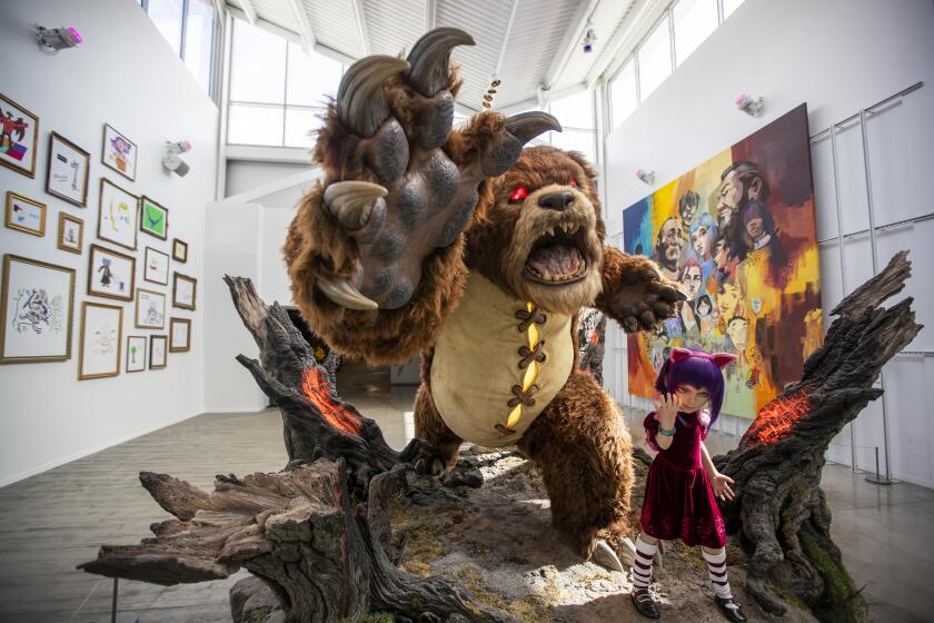 Los Angeles, CA - April 11: Annie and Tibbers: Statue of characters from the League of Legends game, in the new headquarters of Riot Games, a video game developer and esports tournament organizer in Los Angeles Monday, April 11, 2022. The company's expanding real estate footprint in West Los Angeles, with emphasis on what promises to be a very colorful facility where they work. (Allen J. Schaben / Los Angeles Times)