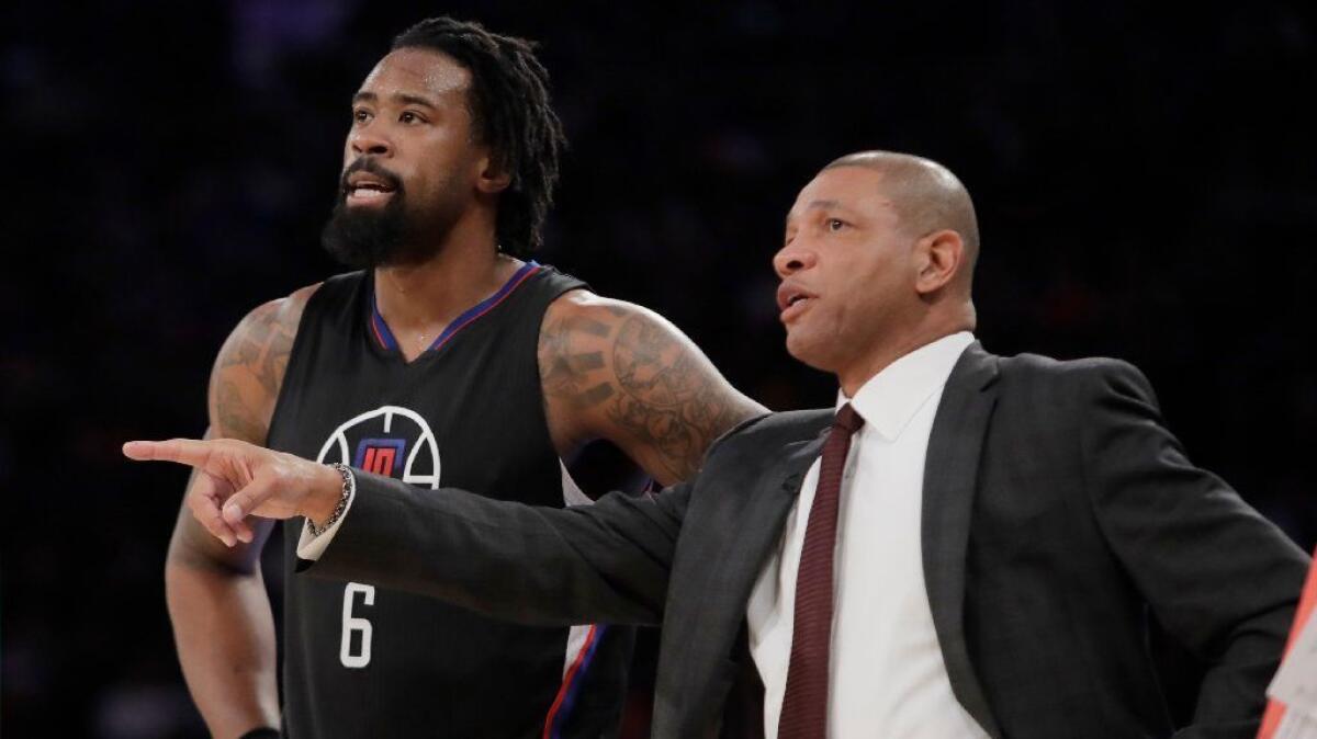 Clippers Coach Doc Rivers speaks to center DeAndre Jordan during the first half of a game against the Knicks in New York on Feb. 8.