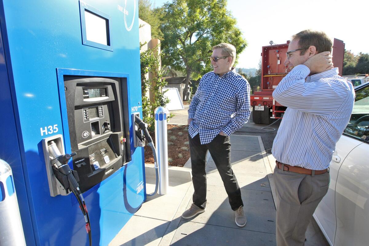 Joel Ewanick, CEO of FirstElement Fuel and co-founder Tim Brown inspect a newly built hydrogen fueling station at La Cañada's ARCO station on Tuesday.