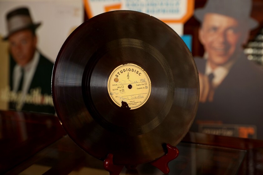 Photograph of a vintage Studiodisc record with Frank Sinatra written on the label.