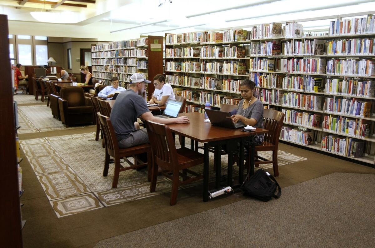 People at work at the Buena Vista Library in Burbank. The Burbank Public Library will conduct several surveys and outreach efforts this fall to adapt to residents' needs.