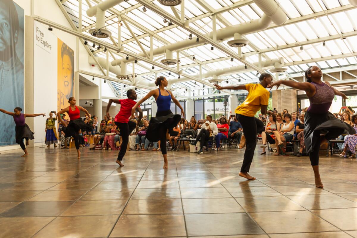 Dancers perform at the California African American Museum.