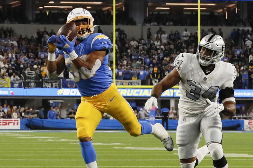 Inglewood CA, Monday, October 4, 2021 - Los Angeles Chargers running back Austin Ekeler (30) catches a touchdown pass.