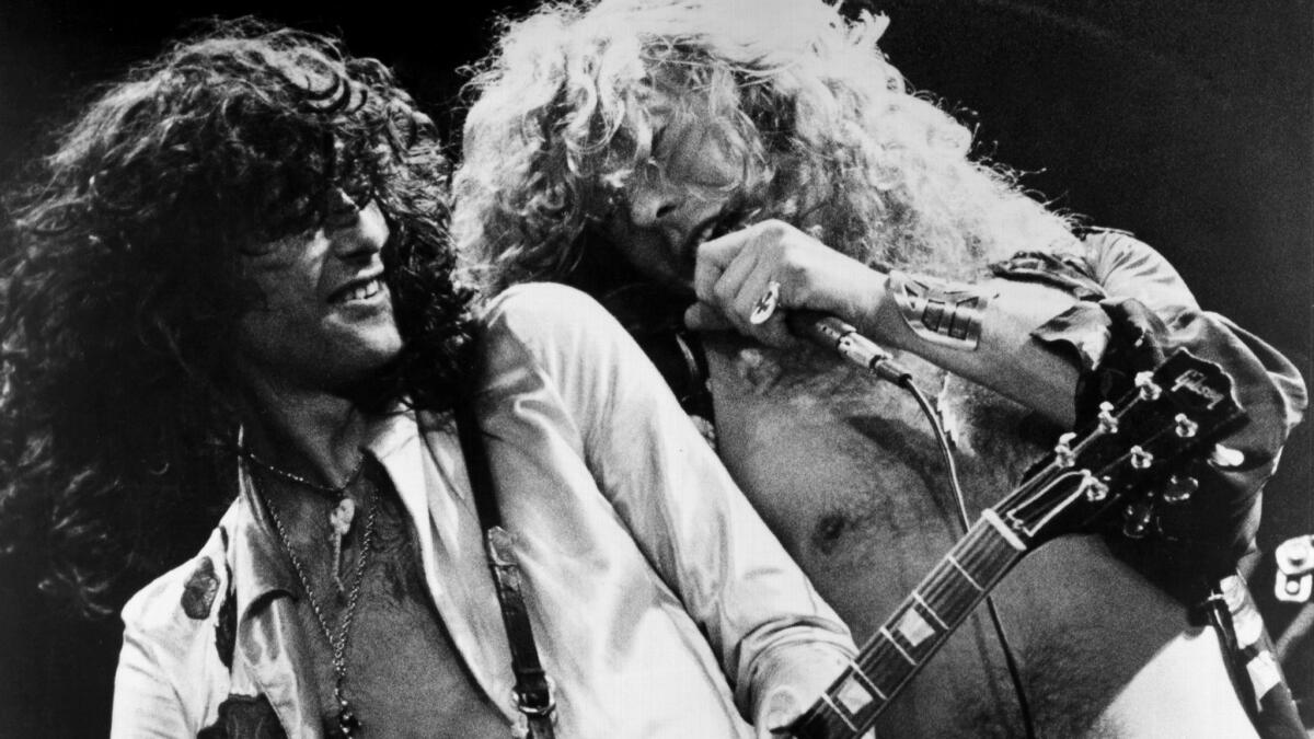 Singer Robert Plant and guitarist Jimmy Page, left, of Led Zeppelin onstage in 1976. Can't we just let them stay there?