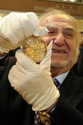 Swatch Group chairman Nicolas Hayek showing a replica of Breguet's famous watch, called Marie-Antoinette, during the Baselworld trade fair in 2008, the leading event for the watch and jewelry industry, in Basel, Switzerland. See full story