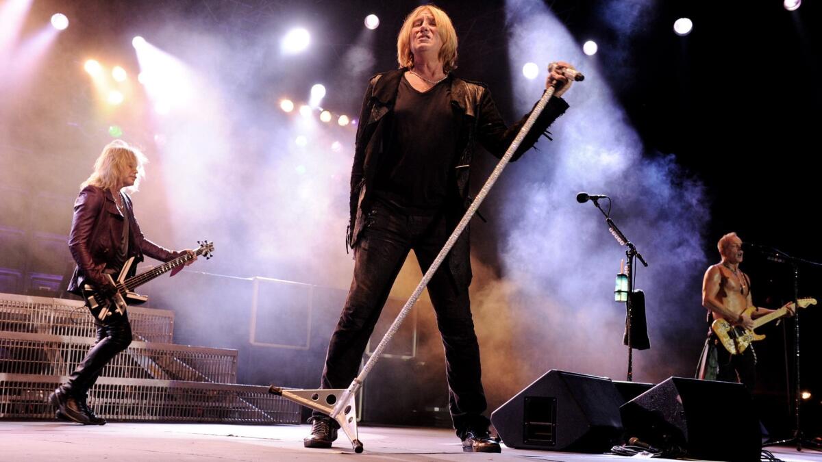 Musicians Rick Savage from left, Joe Elliott and Phill Collen of Def Leppard.