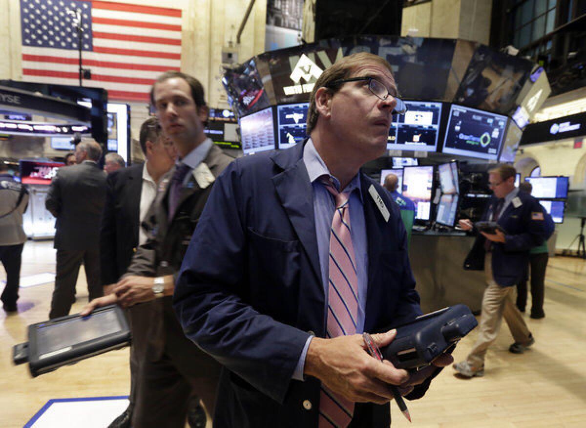 Traders work on the floor of the New York Stock Exchange on Tuesday.