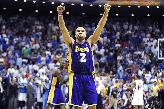 Lakers point guard Derek Fisher celebrates after hitting a key three-pointer against Orlando in overtime at Amway Arena.