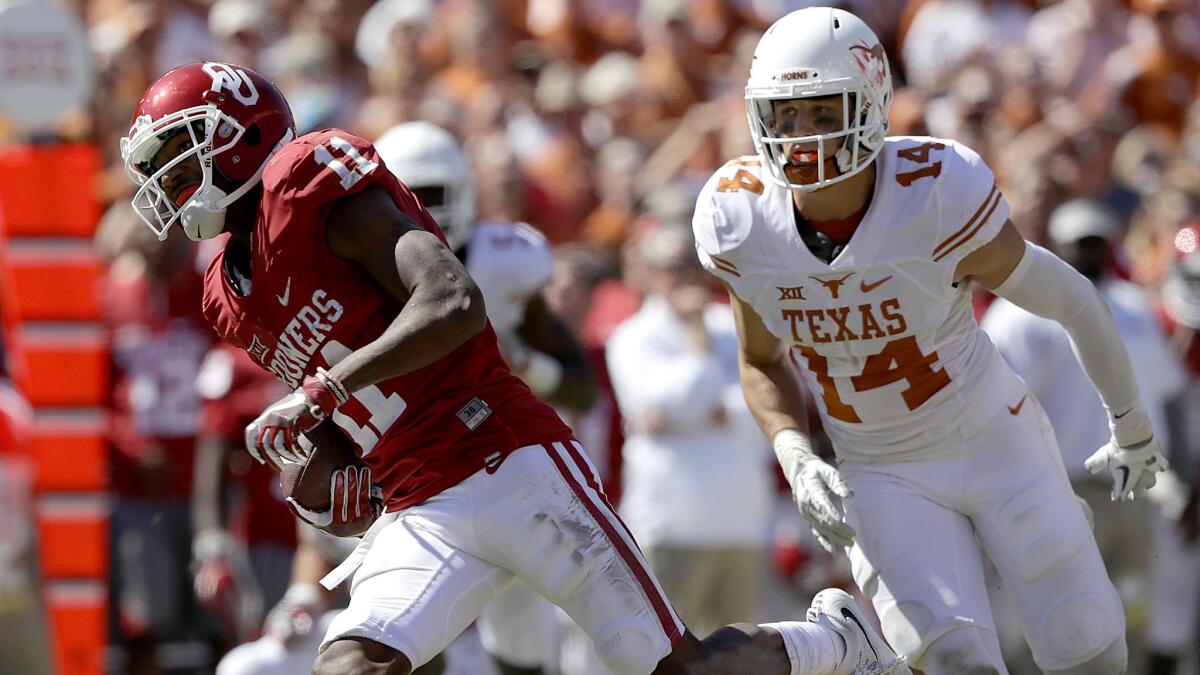 Oklahoma receiver Dede Westbrook breaks into the clear on one of his three touchdown receptions against Texas on Saturday.