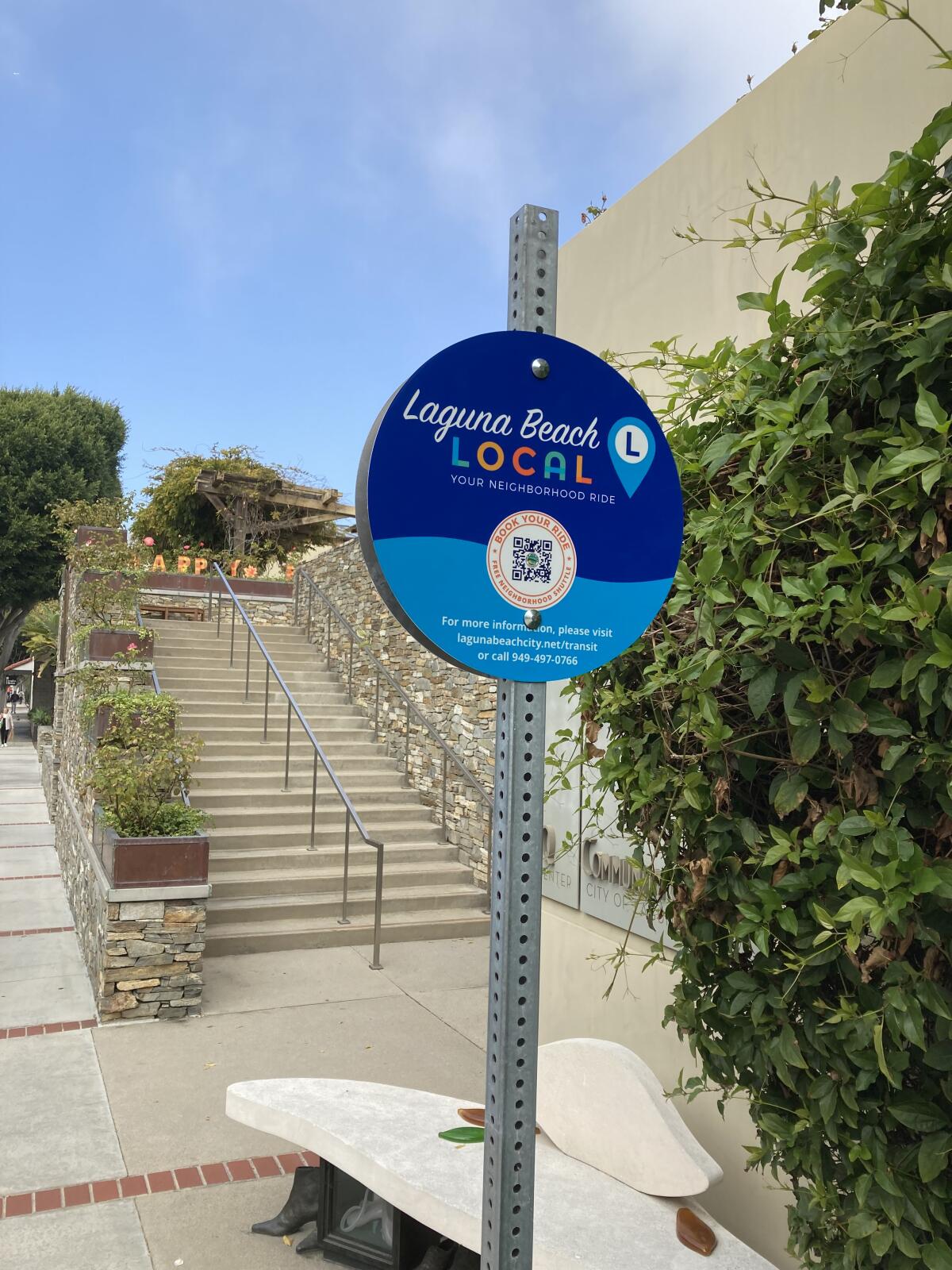 A sign put up for the 'Laguna Beach Local' on-demand transit system.