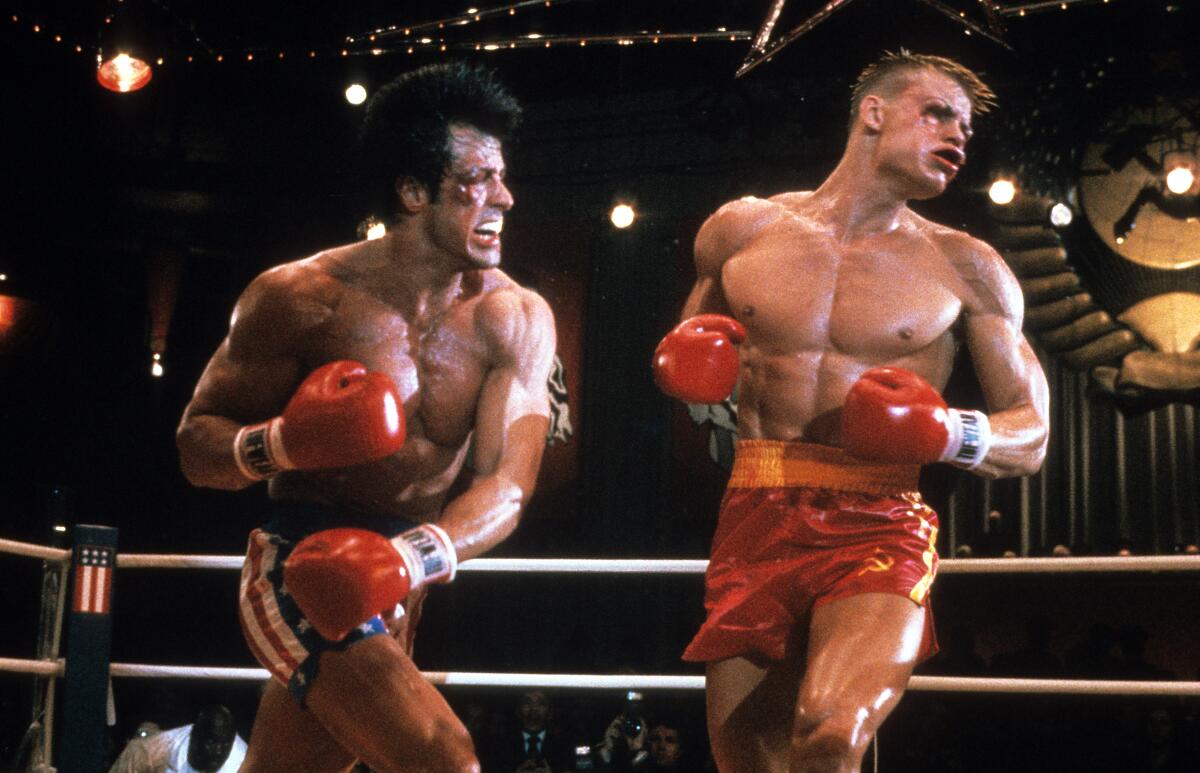 Sylvester Stallone punches Dolph Lundgren in the boxing ring in a scene from "Rocky IV."