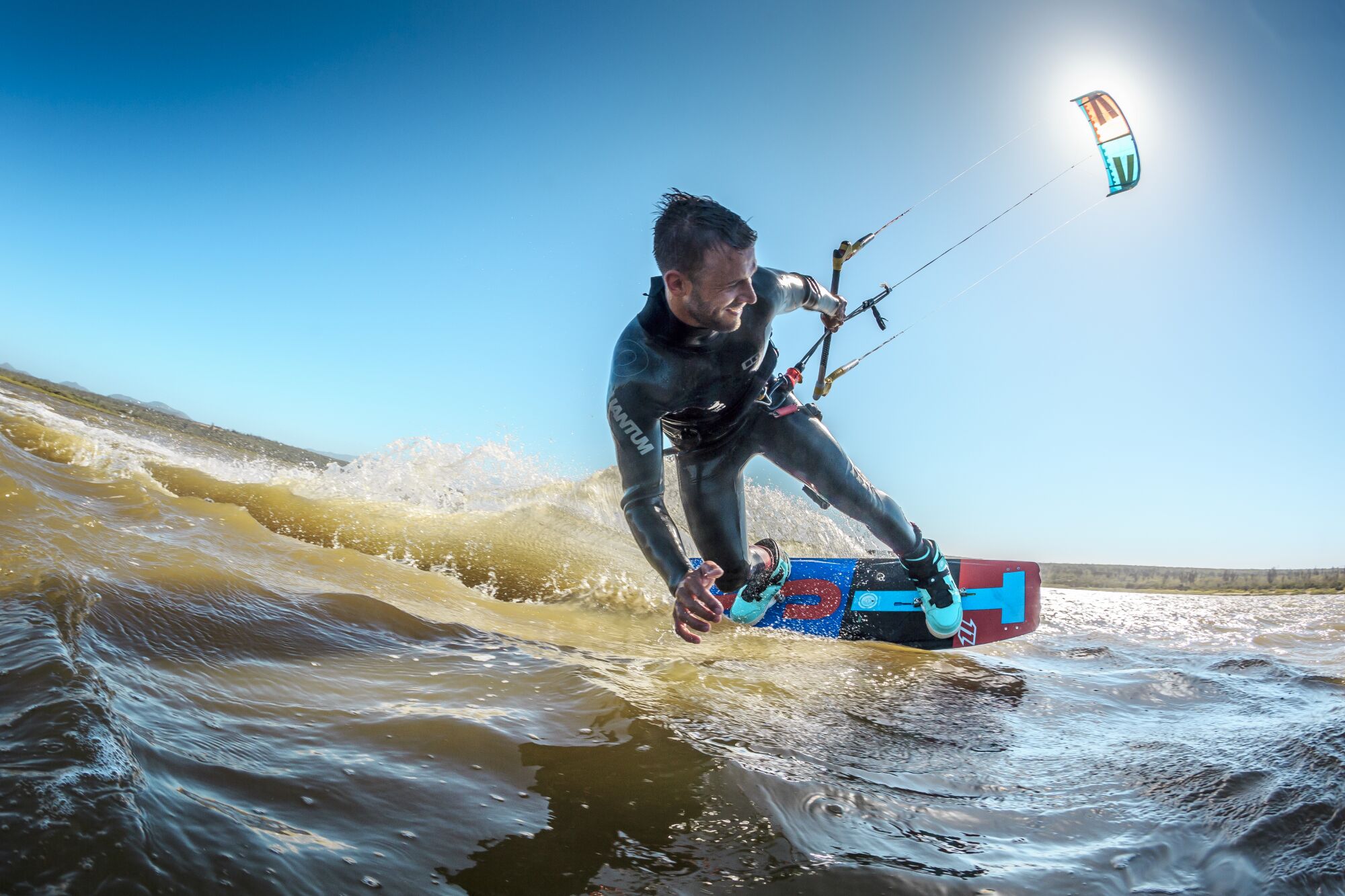 A man kitesurfs