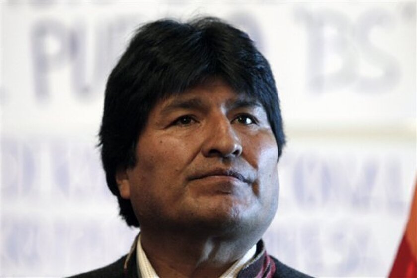 Bolivia's President Evo Morales looks on at the presidential palace as he sets a hunger strike in La Paz, Thursday, April 9, 2009. Morales declared himself on a hunger strike demanding opposition congressmen to approve a law that will open the path for December general elections. (AP Photo/Juan Karita)