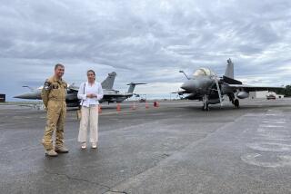 Air Force French air force Brig. Gen. Guillaume Thomas, left, and French Ambassador to Manila Marie Fontanel stand in front of French-made Rafale fighter jets as a nannual French air force mission called Pagase takes place at Clark air base, in Pampanga Province, north of Manila, Philippines, Sunday July 28, 2024. (AP photo/Jim Gomez)