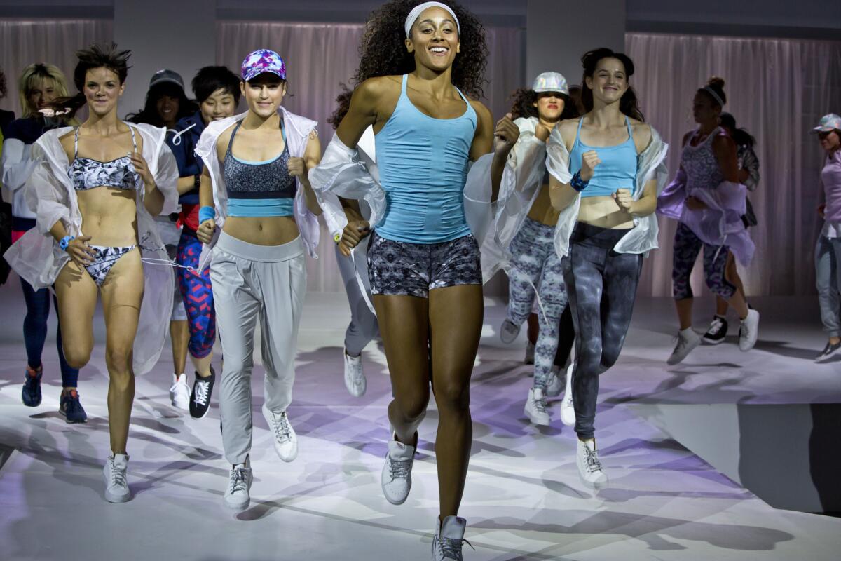 Models cavort in fashions from the Athleta Spring 2015 collection.