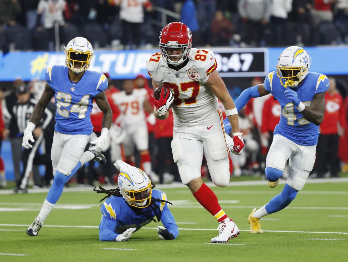 Kansas City Chiefs' Travis Kelce scores the winning touchdown in overtime against the Los Angeles Chargers at SoFi Stadium on Thursday.