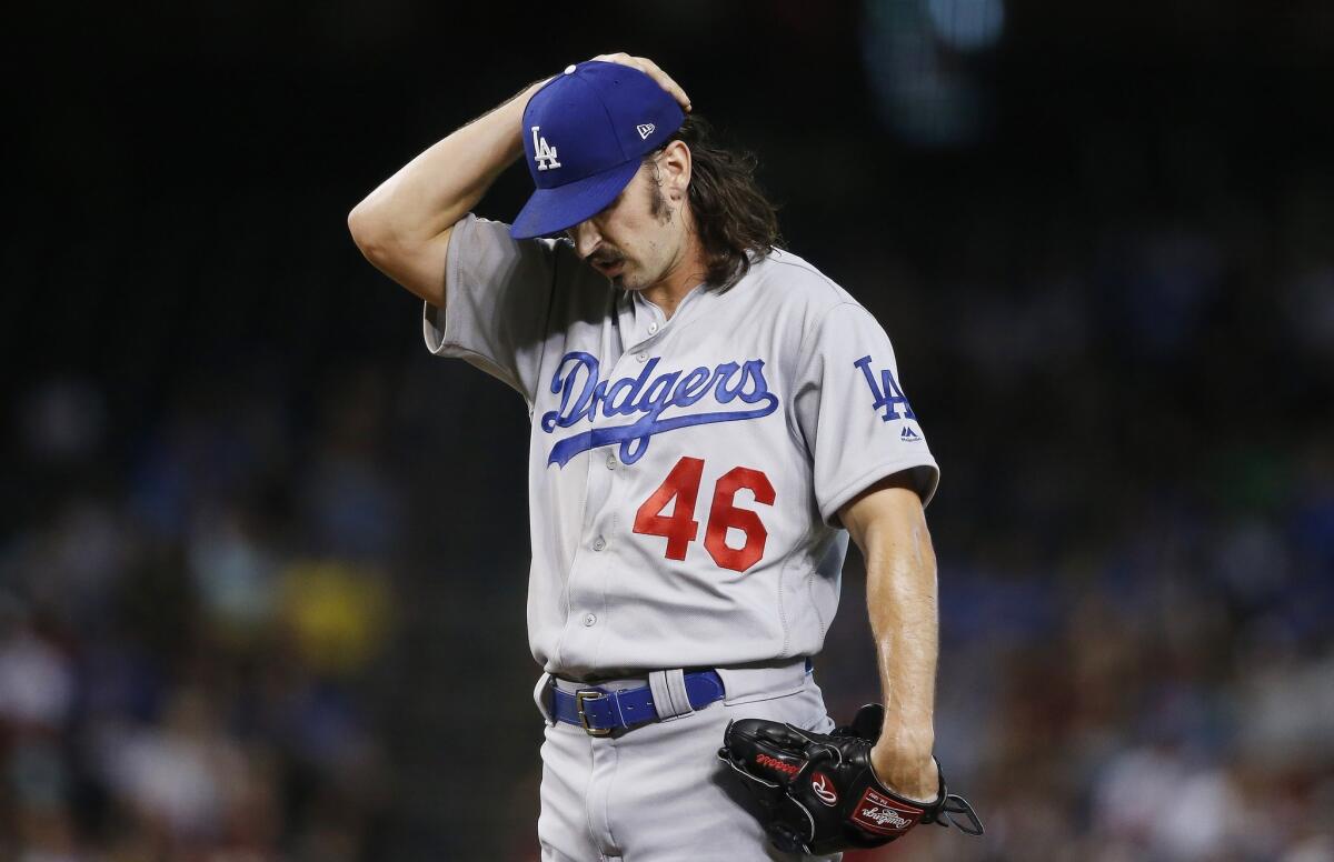 Dodgers starting pitcher Tony Gonsolin pauses on the mound during a game against the Arizona Diamondbacks on June 26.
