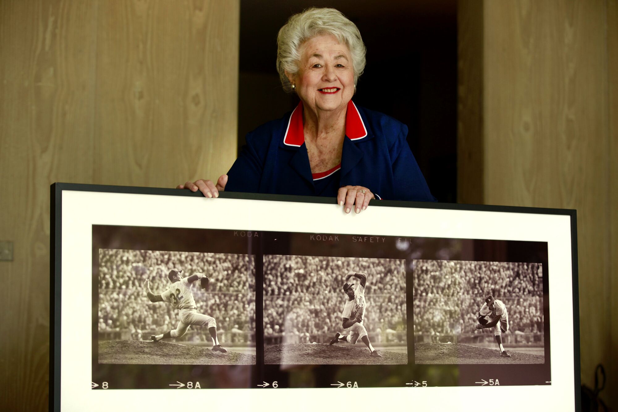 Roz with photo of Sandy Koufax pitching in 1966. 