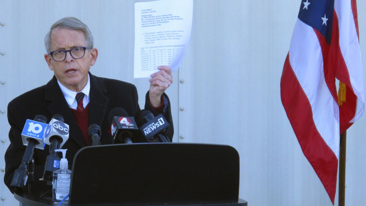 FILE - In this Nov. 18, 2020 file photo, Republican Ohio Gov. Mike DeWine discusses the most recent data on Ohio's soaring coronavirus cases during a news briefing at John Glenn International Airport in Columbus, Ohio. DeWine is ready to address Ohioans in his fourth primetime speech about the state's progress against the coronavirus pandemic. DeWine planned his address for late Wednesday, May 12, 2021. (AP Photo/Andrew Welsh-Huggins)