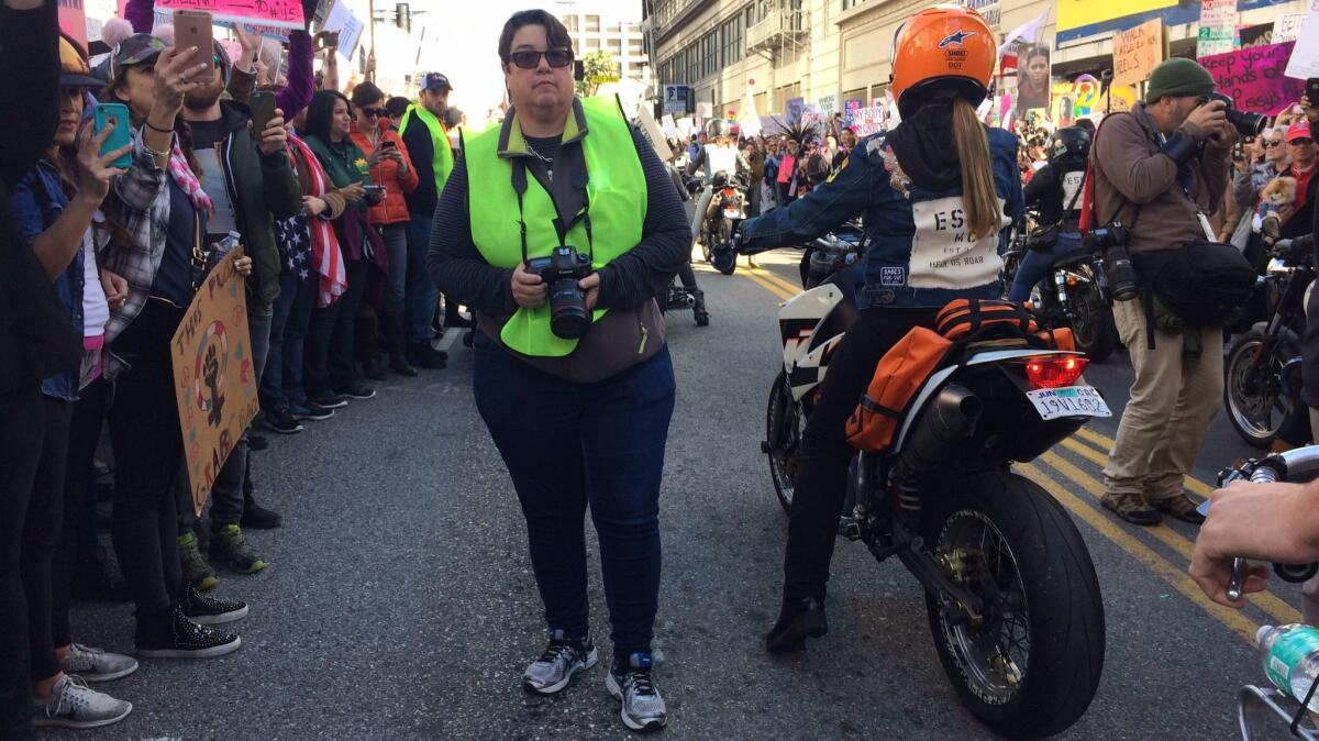 Photographer Catherine Opie waits for the women's march to kick off in downtown Los Angeles.
