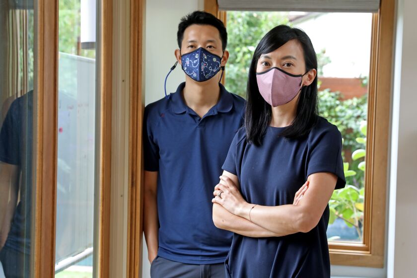LOS ANGELES, CA - AUGUST 23: Ed Hwang and wife Melinda Hwang, founders of Happy Masks, a face mask with nanofiber membrane technology to protect against airborne viruses, on Monday, Aug. 23, 2021 in Los Angeles, CA. (Gary Coronado / Los Angeles Times)