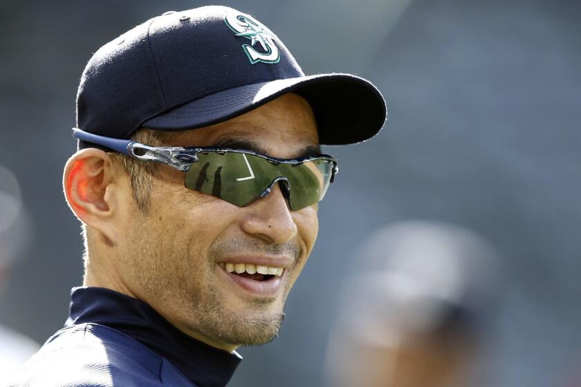 FILE - In this Tuesday, July 10, 2018 file photo, Seattle Mariners' Ichiro Suzuki, of Japan, smiles during warm ups before a baseball game against the Los Angeles Angels in Anaheim, Calif. Ichiro Suzuki has agreed to a minor-league deal with the Seattle Mariners paving the way for the 45-year-old to play in Seattles season-opening series in Japan. Suzukis agent, John Boggs, confirmed the agreement on Wednesday, Jan. 23, 2019. (AP Photo/Alex Gallardo, File)