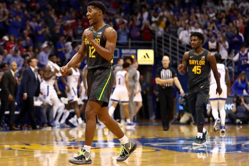 LAWRENCE, KANSAS - JANUARY 11: Jared Butler #12 of the Baylor Bears reacts after scoring during the game against the Kansas Jayhawks at Allen Fieldhouse on January 11, 2020 in Lawrence, Kansas. (Photo by Jamie Squire/Getty Images)